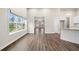 Spacious living room featuring hardwood floors, neutral paint, an open layout and granite countertops at 8230 Dawson View Way, Cumming, GA 30028