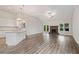 Bright, open-plan with hardwood floors, fireplace, and backyard access at 8230 Dawson View Way, Cumming, GA 30028