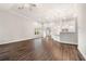 Spacious living room featuring hardwood floors, neutral paint, an open layout, and modern lighting at 8230 Dawson View Way, Cumming, GA 30028