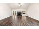 Expansive open living area featuring hardwood flooring and fireplace at 8230 Dawson View Way, Cumming, GA 30028