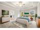Bright main bedroom featuring a tray ceiling, ceiling fan and two windows bringing in natural light at 8230 Dawson View Way, Cumming, GA 30028