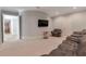 Basement recreational room with a large comfortable leather sofa at 140 Johnson Rd, Suwanee, GA 30024