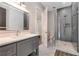 Modern bathroom with a walk-in shower, patterned floors, and a sleek vanity at 140 Johnson Rd, Suwanee, GA 30024