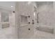 The marble bathroom has dual vanities, a soaking tub, and a glass-enclosed shower at 140 Johnson Rd, Suwanee, GA 30024