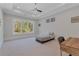 Bedroom with large windows, ample natural light, and a ceiling fan at 140 Johnson Rd, Suwanee, GA 30024