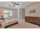 Bedroom featuring a ceiling fan, a comfortable bed, a large dresser, and natural light at 140 Johnson Rd, Suwanee, GA 30024