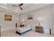 Cozy bedroom featuring a ceiling fan, a comfortable bed, and walls adorned with lovely art at 140 Johnson Rd, Suwanee, GA 30024