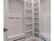 Walk-in closet featuring white shelving and drawers to keep clothes and accessories organized and accessible at 140 Johnson Rd, Suwanee, GA 30024