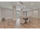 Large dining room with hardwood floors, a center support beam, and ample seating for entertaining at 140 Johnson Rd, Suwanee, GA 30024