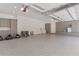 Well-organized garage with ample storage cabinets, epoxy floors, and overhead lighting at 140 Johnson Rd, Suwanee, GA 30024