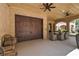 Spacious covered patio with wood garage door and an elegant dining set, perfect for outdoor gatherings at 140 Johnson Rd, Suwanee, GA 30024