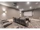 Home theater with tiered seating, a projector, and a large screen for entertainment at 140 Johnson Rd, Suwanee, GA 30024