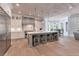 Spacious kitchen features a large island with seating, stainless steel appliances, and custom cabinetry at 140 Johnson Rd, Suwanee, GA 30024