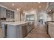 Spacious kitchen with island and stainless appliances and a breakfast bar at 140 Johnson Rd, Suwanee, GA 30024