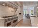 Gourmet kitchen features high-end stainless steel appliances and elegant finishes at 140 Johnson Rd, Suwanee, GA 30024