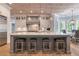Spacious kitchen with a large island, stainless steel appliances, and stylish lighting at 140 Johnson Rd, Suwanee, GA 30024