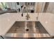 Close-up of a stainless steel kitchen sink with modern faucet and white quartz countertop at 140 Johnson Rd, Suwanee, GA 30024