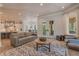 Spacious living room with open layout connected to kitchen and access to outdoor patio at 140 Johnson Rd, Suwanee, GA 30024