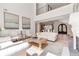 Bright living room features high ceilings, neutral furniture, and seamless flow to entryway at 140 Johnson Rd, Suwanee, GA 30024