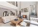Elegant living room showcasing fireplace, stylish decor, and seamless flow to other living spaces at 140 Johnson Rd, Suwanee, GA 30024
