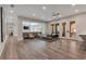 Spacious living room featuring neutral walls and furniture, an open concept, and hardwood floors at 140 Johnson Rd, Suwanee, GA 30024