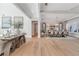 Spacious living area flowing into the dining room with hardwood floors and elegant decor at 140 Johnson Rd, Suwanee, GA 30024