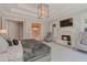 A fireplace, a chandelier, and an open door to the bathroom are visible from the main bedroom at 140 Johnson Rd, Suwanee, GA 30024