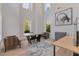 Bright office features soaring ceilings, modern desk, and decorative rug adding a touch of sophistication at 140 Johnson Rd, Suwanee, GA 30024