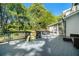 Large back deck with a seating area, a grill, and views of the wooded backyard at 180 Spring Ridge Trace, Roswell, GA 30076