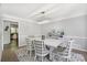 Dining room with a modern light fixture and white table at 180 Spring Ridge Trace, Roswell, GA 30076
