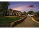 Beautiful brick home featuring a long driveway and well-manicured lawn at 180 Spring Ridge Trace, Roswell, GA 30076