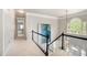 Hallway with decorative railing and window at 180 Spring Ridge Trace, Roswell, GA 30076