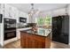Kitchen featuring a central island and modern appliances at 180 Spring Ridge Trace, Roswell, GA 30076