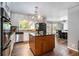 Updated kitchen with a central island and modern appliances at 180 Spring Ridge Trace, Roswell, GA 30076