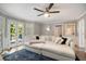 Bright living room with a plush sectional sofa and access to the outdoors through glass doors at 180 Spring Ridge Trace, Roswell, GA 30076