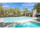 Community amenities including a pool, recreation area and covered gathering spaces, all within view of select homes at 180 Spring Ridge Trace, Roswell, GA 30076