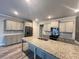 Well-equipped kitchen with a large island, granite countertops, and stainless steel appliances at 2458 Morgan Creek Rd, Buford, GA 30519