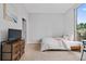Well-lit bedroom featuring plush carpet, large window, and contemporary decor at 2626 Peachtree Nw Rd # 606, Atlanta, GA 30305
