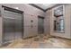 Modern elevator bank featuring a tiled floor and mirrored wall, providing convenient access to all floors at 2626 Peachtree Nw Rd # 606, Atlanta, GA 30305