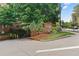 Building address sign with manicured landscaping, brick accents, and street views at 2626 Peachtree Nw Rd # 606, Atlanta, GA 30305