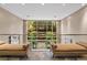 Bright lobby with large windows overlooking greenery and comfortable lounge seating on top of slate flooring at 2626 Peachtree Nw Rd # 606, Atlanta, GA 30305