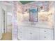 Unique bathroom with flamingo wallpaper, designer mirrors, and a large vanity with a stone countertop at 2773 Brookgrove Se Ln, Atlanta, GA 30339