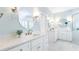 Bright bathroom featuring double vanity sinks, marble countertops, and elegant lighting fixtures at 2773 Brookgrove Se Ln, Atlanta, GA 30339