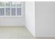 Bright bedroom featuring a large window with white shutters and neutral carpet at 2773 Brookgrove Se Ln, Atlanta, GA 30339