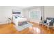 Spacious bedroom with hardwood floors, large window, and tasteful decor at 2773 Brookgrove Se Ln, Atlanta, GA 30339