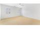 An empty bedroom with neutral carpet, white walls, and two windows with shutters at 2773 Brookgrove Se Ln, Atlanta, GA 30339