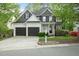 Charming two-story home with a two-car garage, and landscaped front yard at 2773 Brookgrove Se Ln, Atlanta, GA 30339