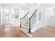 Elegant foyer with hardwood flooring and a staircase featuring black railing at 2773 Brookgrove Se Ln, Atlanta, GA 30339