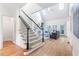 Open foyer with hardwood floors, staircase, and sunlit living area at 2773 Brookgrove Se Ln, Atlanta, GA 30339