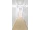 Hallway with neutral carpet leading to other rooms; features white trim and doors at 2773 Brookgrove Se Ln, Atlanta, GA 30339
